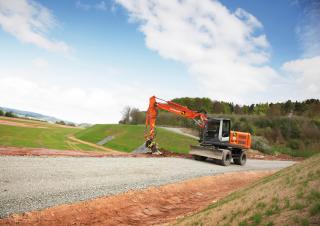 Kolová rypadla Hitachi ZX 140 W 3