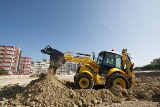 Rypadlo-nakladače New Holland B100C