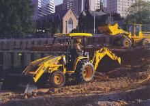 Rypadlo-nakladače John Deere Construction 110