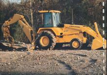 Rypadlo-nakladače John Deere Construction 610 C