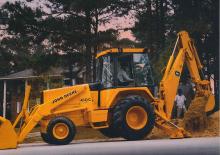Rypadlo-nakladače John Deere Construction 710 B